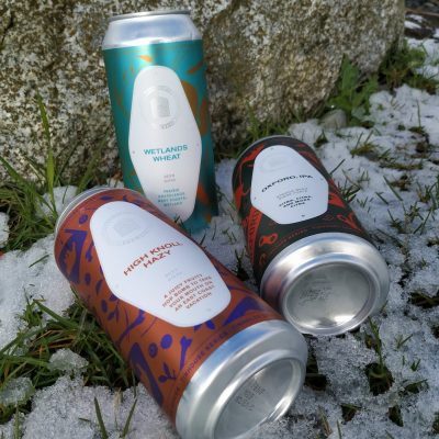 Hazy Wheat Oxford Three Cans Outside